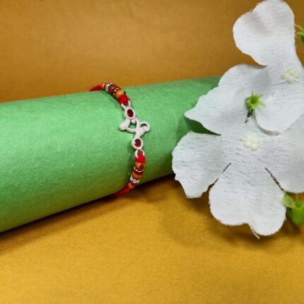 Designer Pure Silver Om Rakhi with Red Stones & Beads