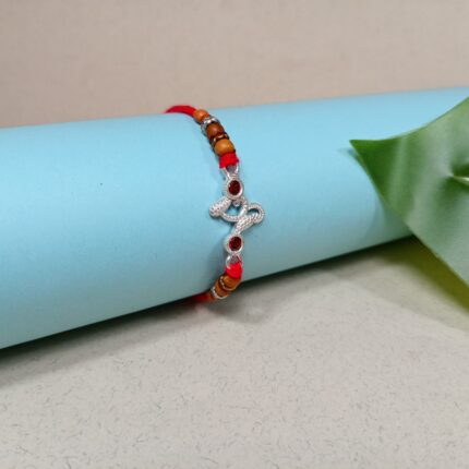 Designer Pure Silver Om Rakhi with Red Stones & Beads