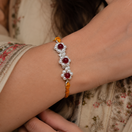 925 Silver Floral Rakhi with Red Beads