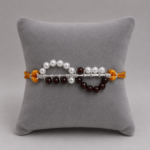 Timeless Maroon Pearl Rakhi: Celebrating Sibling Bond with Elegance