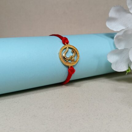 Divine Om Golden Rakhi: Sterling Silver Elegance