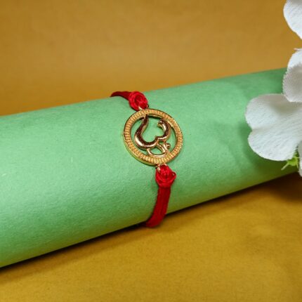 Divine Om Golden Rakhi: Sterling Silver Elegance