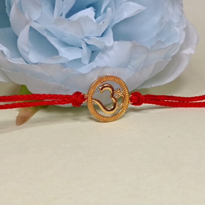 Divine Om Golden Rakhi: Sterling Silver Elegance