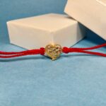 Elegant Silver 925 Golden Rakhi: Symbol of Timeless Bond