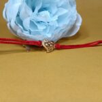Elegant Silver 925 Golden Rakhi: Symbol of Timeless Bond