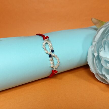 Elegant 925 Silver Rakhi with Pearls & Blue Stone Accents