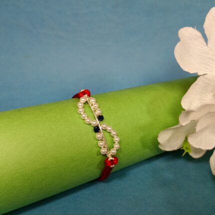 Elegant 925 Silver Rakhi with Pearls & Blue Stone Accents