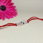 Elegant 925 Silver Rakhi with Pearls & Blue Stone Accents