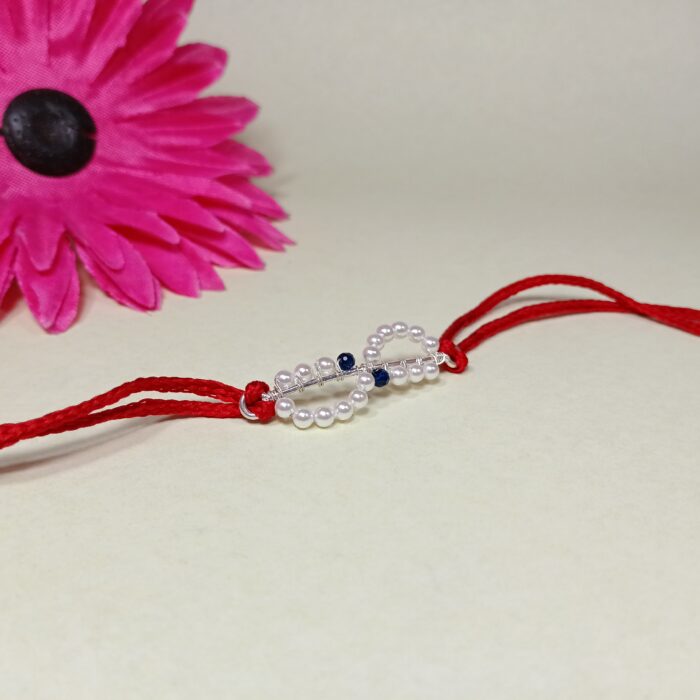 Elegant 925 Silver Rakhi with Pearls & Blue Stone Accents