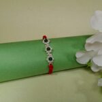 925 Silver Floral Rakhi with Green Beads