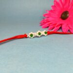 925 Silver Floral Rakhi with Green Beads