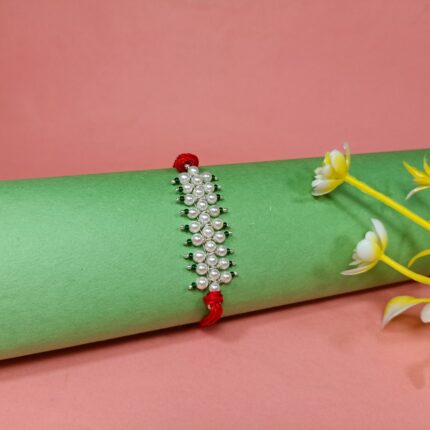 Radiant Pearl Rakhi: Graceful Bonds of Siblings
