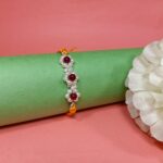 925 Silver Floral Rakhi with Red Beads
