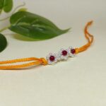 925 Silver Floral Rakhi with Red Beads