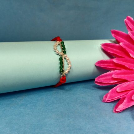 Timeless Red Pearl Rakhi: Celebrating Sibling Bond with Elegance