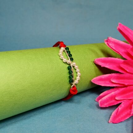 Timeless Red Pearl Rakhi: Celebrating Sibling Bond with Elegance