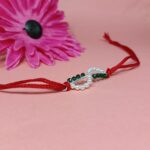 Timeless Red Pearl Rakhi: Celebrating Sibling Bond with Elegance