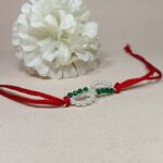 Timeless Red Pearl Rakhi: Celebrating Sibling Bond with Elegance