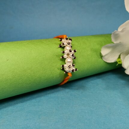 925 Silver Pearl Cluster Rakhi with Elegant Bead Detailing