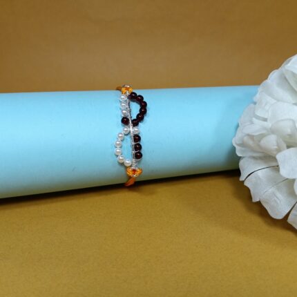 Timeless Maroon Pearl Rakhi: Celebrating Sibling Bond with Elegance