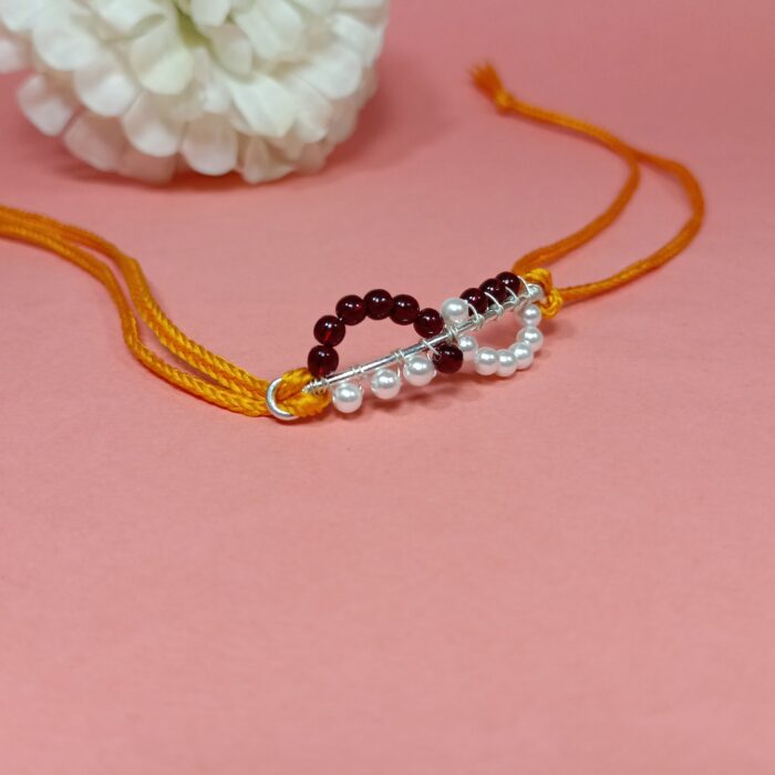 Timeless Maroon Pearl Rakhi: Celebrating Sibling Bond with Elegance