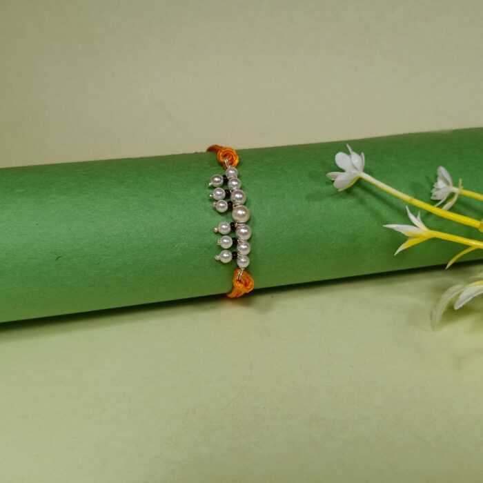 Elegant Pearl Beaded Rakhi with Orange Thread