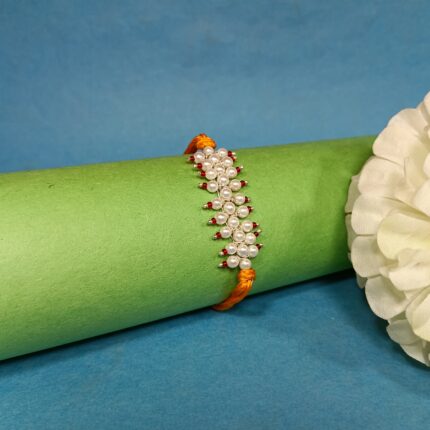 Radiant pink Pearl Rakhi: Graceful Bonds of Siblings