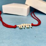 925 Silver Green Pearl Rakhi on Red Thread