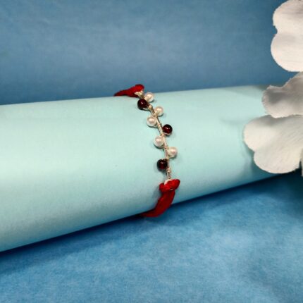 925 Silver Maroon Moti Rakhi: Timeless Pearl Elegance