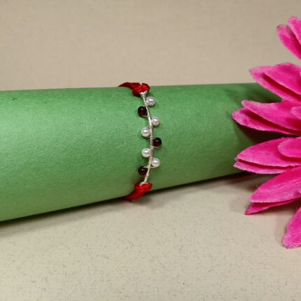 925 Silver Maroon Moti Rakhi: Timeless Pearl Elegance