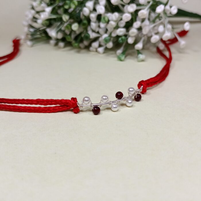 925 Silver Maroon Moti Rakhi: Timeless Pearl Elegance