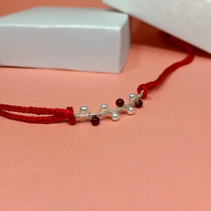 925 Silver Maroon Moti Rakhi: Timeless Pearl Elegance