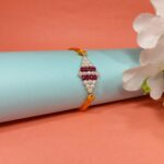 925 Silver Rakhi with Pearl & Ruby Beads on Orange Thread