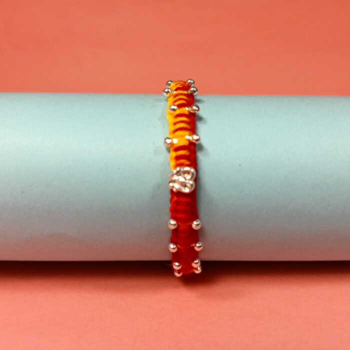 Agni Raksha Sutra – Dual Tone Thread Rakhi with 925 Silver Charm