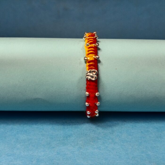 Agni Raksha Sutra – Dual Tone Thread Rakhi with 925 Silver Charm