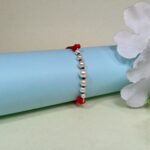 Timeless Pearl & Red Thread Rakhi: A Symbol of Pure Bond