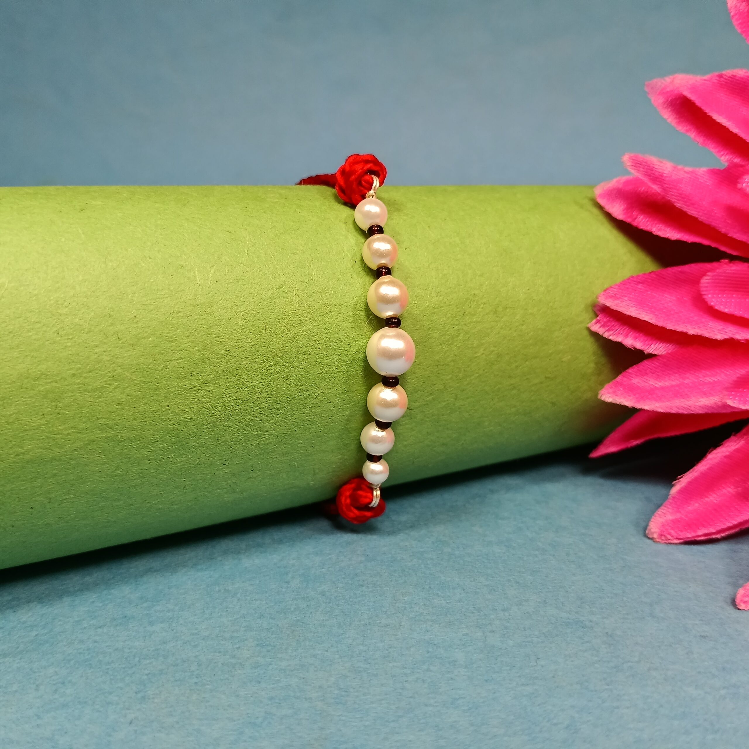 IMG_20250708_185912 Timeless Pearl & Red Thread Rakhi: A Symbol of Pure Bond