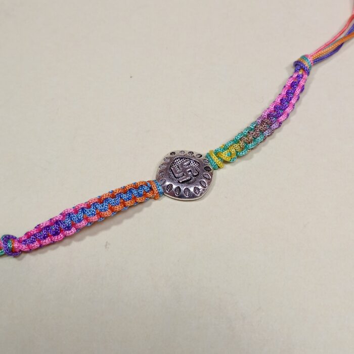 Auspicious Swastika Silver Medallion Rakhi with Multi-Color Thread
