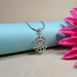 Pure Silver Swastik Pendant – Radiant Sun Motif with Pink CZ Stones