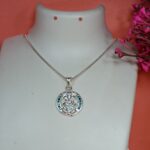 Pure Silver Lord Ganesha Pendant – Oval Frame with Green & Blue CZ Stones
