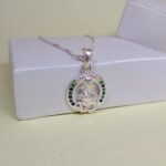 Pure Silver Lord Ganesha Pendant – Oval Frame with Green & Blue CZ Stones