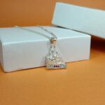 Silver Seated Ganesha Pendant – Elegant Design with Pink & White CZ Accents
