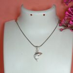 Silver Dolphin Pendant – Graceful Ocean Charm with Red CZ Eye