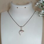 Silver Dolphin Pendant – Graceful Ocean Charm with Red CZ Eye