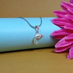 Silver Dolphin Pendant – Graceful Ocean Charm with Red CZ Eye