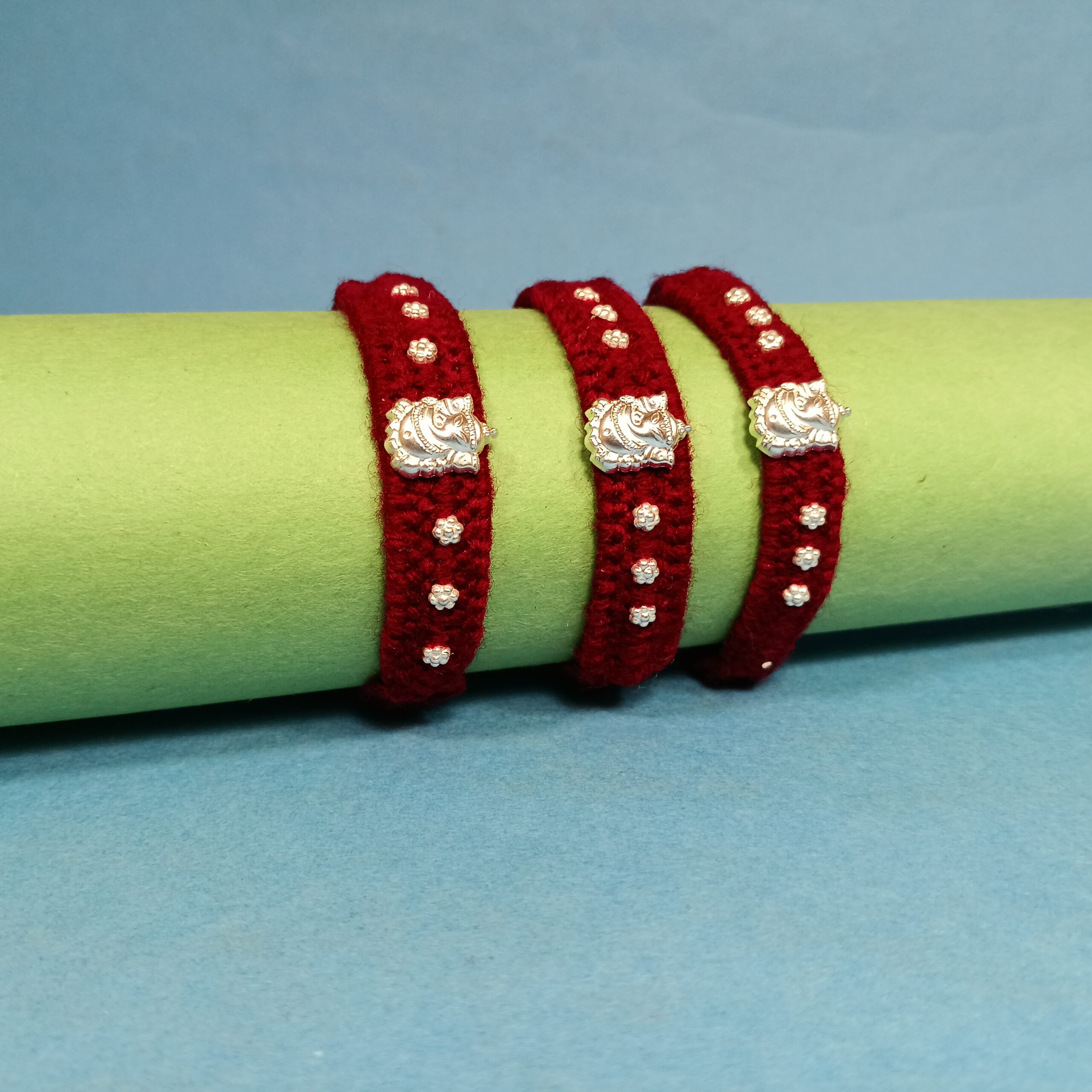 IMG_20250724_185016 Pure Silver Ganesha Rakhi – Sacred Protection Thread in Maroon (3 pieces )