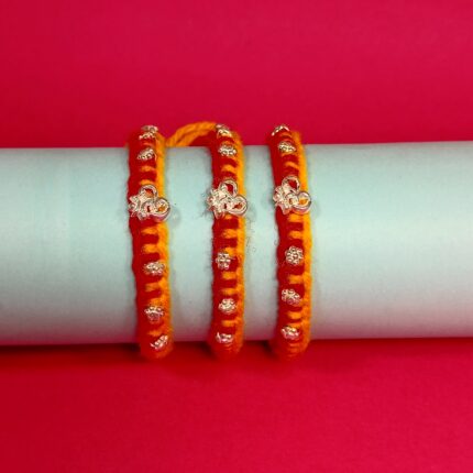 Pure Silver OM Rakhi – Auspicious Red & Yellow Thread with Sparkling CZ Stones