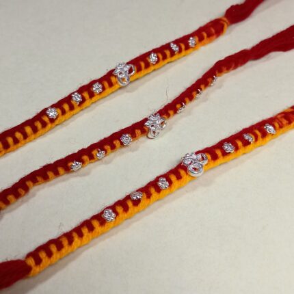 Pure Silver OM Rakhi – Auspicious Red & Yellow Thread with Sparkling CZ Stones