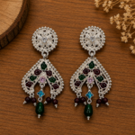 edit silver earring with wooden background