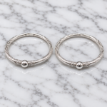 Elegant Pure Silver Kids Leg Kada Pair with stylish twisted detailing and traditional design, perfect for festivals, special occasions, and gifting.Pure Silver Kids Leg Kada Pair | Designer Silver Payal for Kids